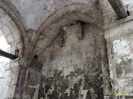 Blocked column-type belt at the junction of the arch of the Northern passage to the wall of the Church of the Nativity of the virgin in the hierarchy.