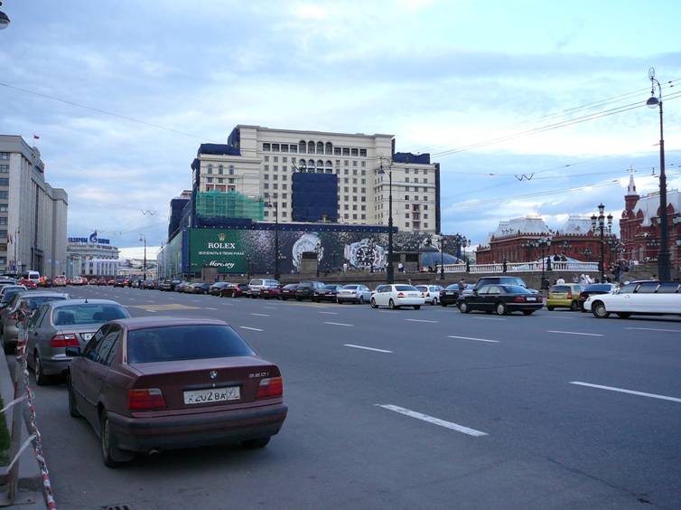 In the early 2000's Moscow authorities had a chance to remedy the situation at least partially: Moscow hotel, looming over Kremlin, was demolished (as inappropriate to modern hotel standards), and if at its place had remained the square, urban environment atmosphere around Kremlin would have been significantly improved. But the hotel brings more money, so it was lined up again (naturally, with more comfortable interiors). As a result the tough dummy now hangs above Kremlin.